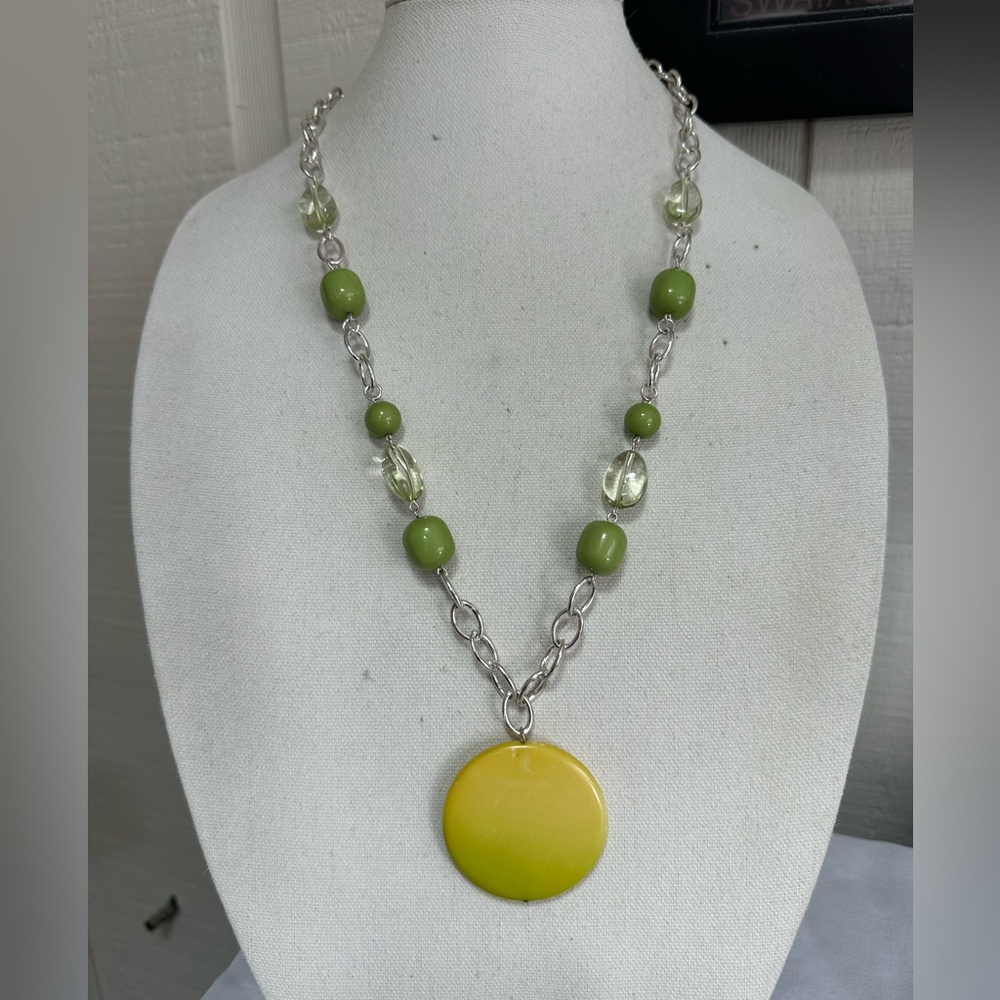Long abstract vibe silvertone chain and green bead pendant necklace